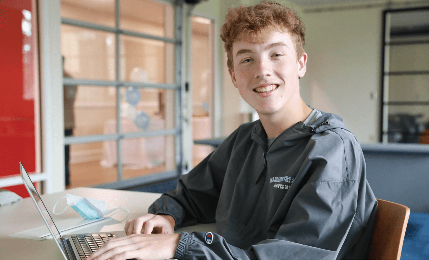 boy sitting at laptop